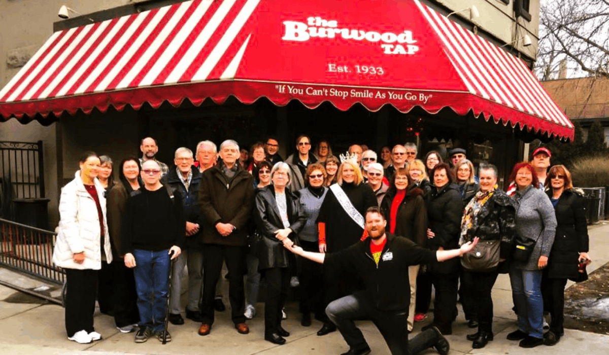 group posing outside of the burwood tap in chicago