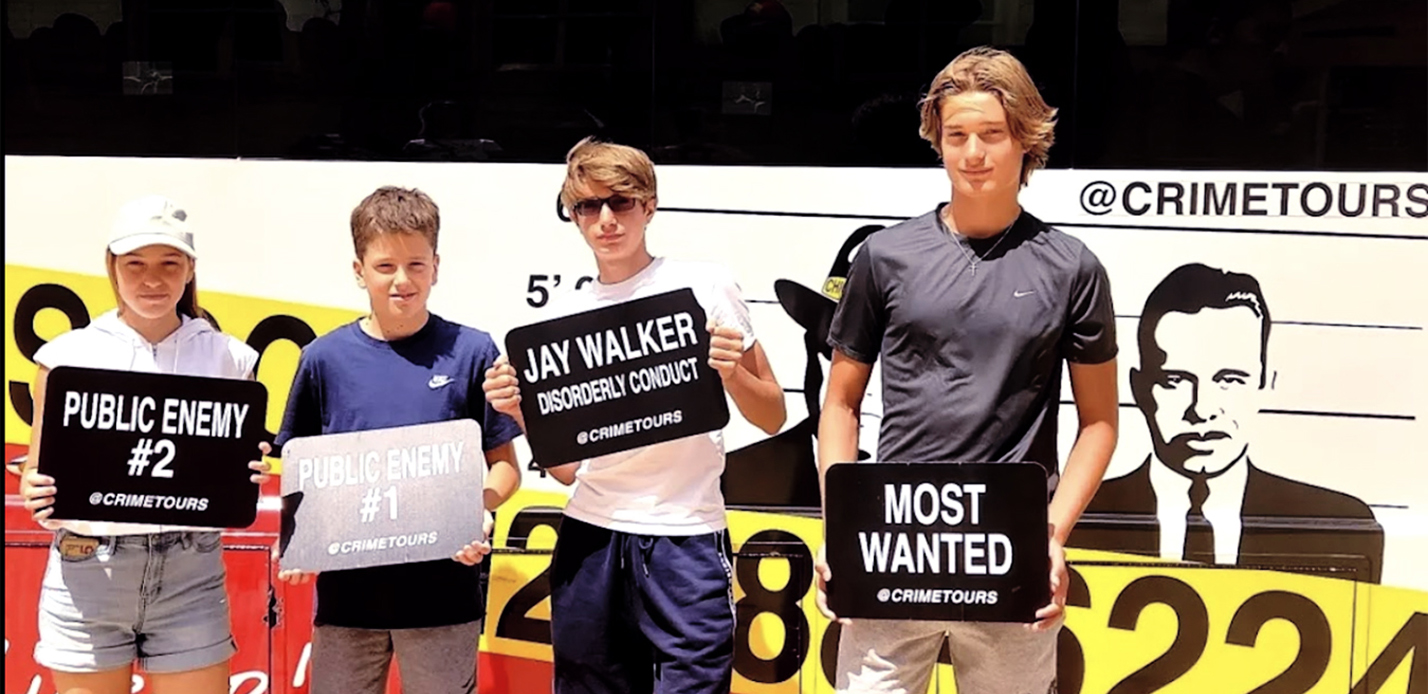 Kids at the bus holding signs