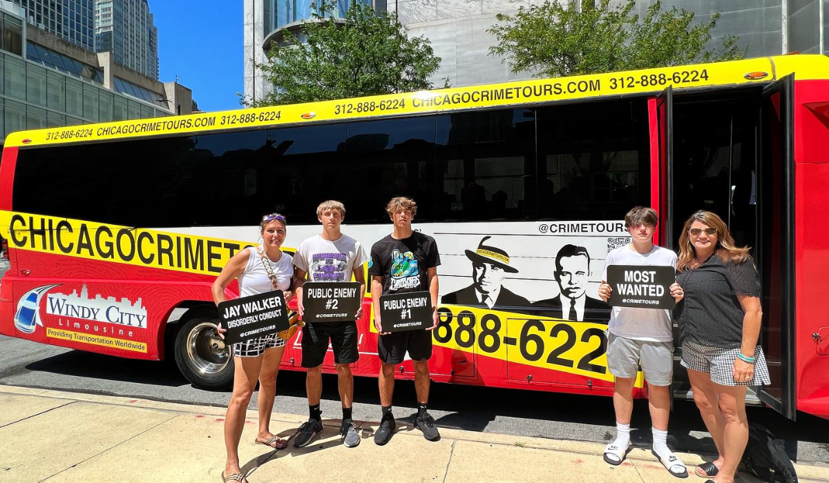 family standing in front of the chicago crime tours bus